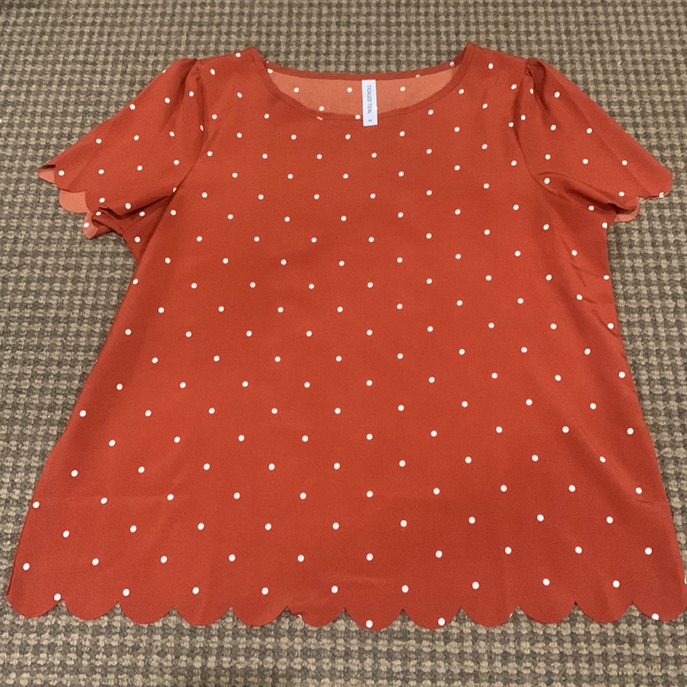 Orange and white polka dot scalloped blouse